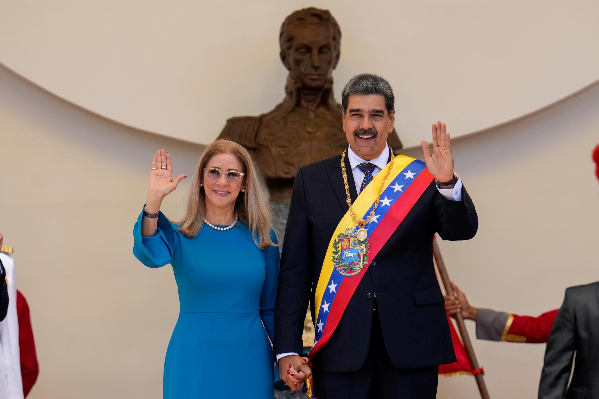 Venezuelan President Nicolas Maduro and his wife Cilia Flores wave after his swearing-in ceremony for a third term at the National Assembly in Caracas, Venezuela, on January 10, 2025.