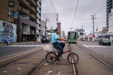 Kanazawa riding his bike in Hiroshima before gym train