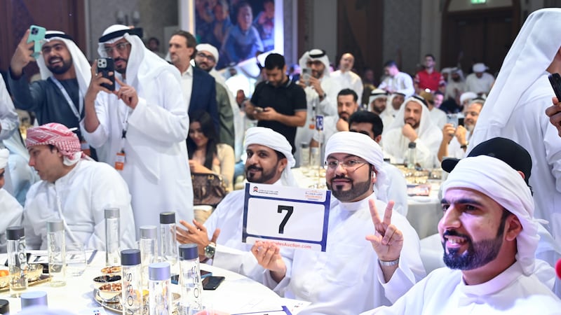 The winner of the Dubai 7 number plate at the charity auction