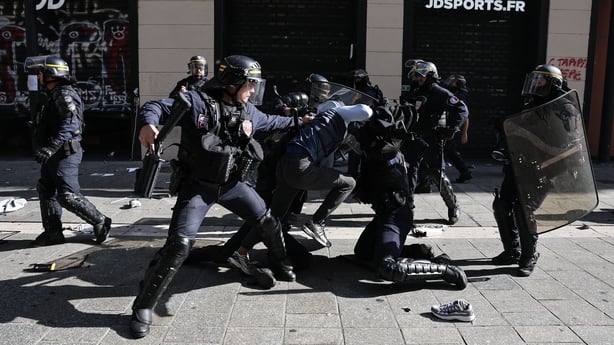 French Republican Security Corps (CRS - Compagnies Republicaines de Securite) detain a protester during clashes prior to the start of a demonstration to protest against the "high cost of living", in Marseille,